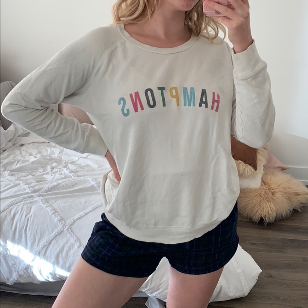 Hampton’s white sweater